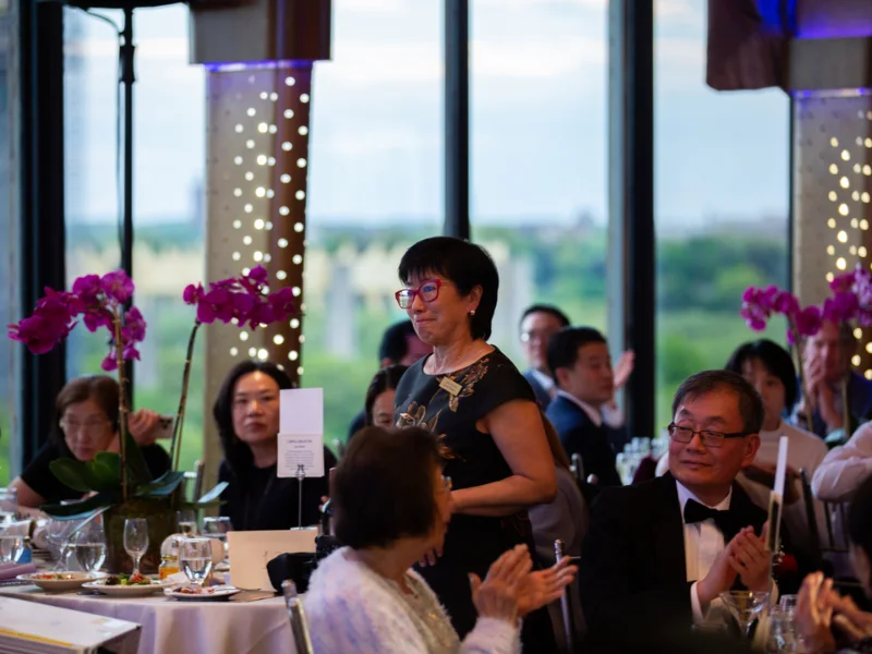 Chairwoman Lana Choy walking up to give her speech at the Visionaries of Tomorrow 2026 Gala.