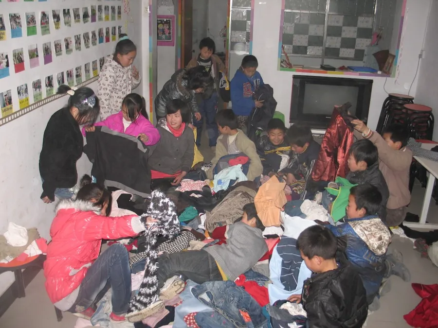 Choosing clothes, Henan children's center.