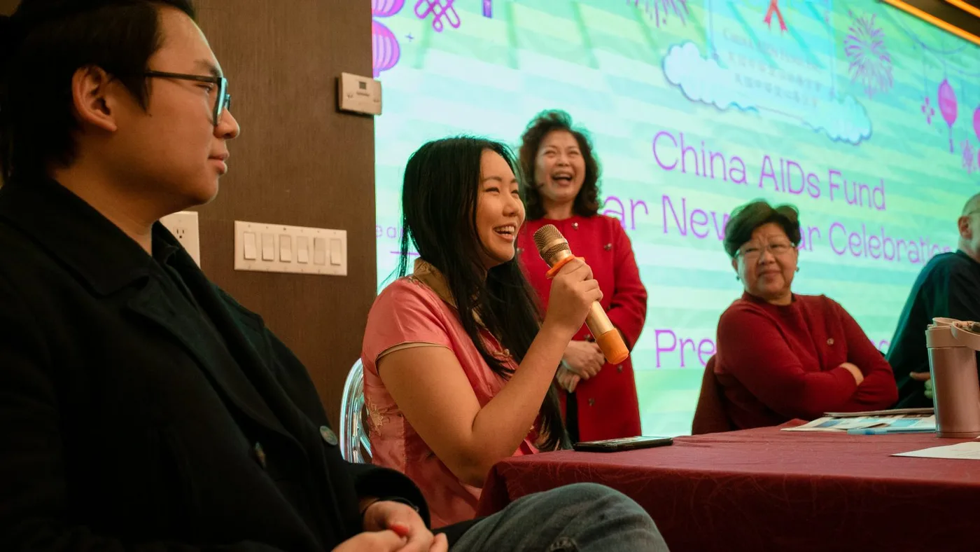 Emily Chan sharing her story and history with Professor Chou, reflecting on good memories.